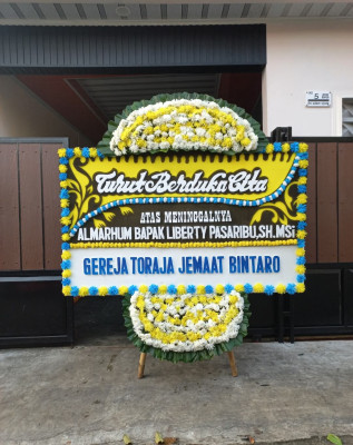 Papan Bunga Duka di Asuhan